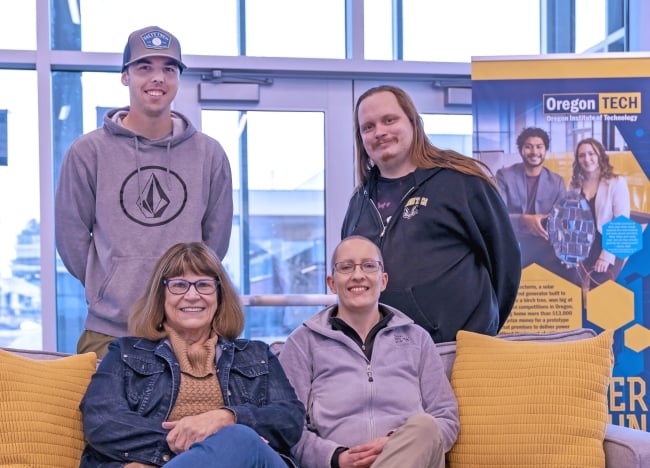 Four Oregon Institute of Technology students smile for a photo.